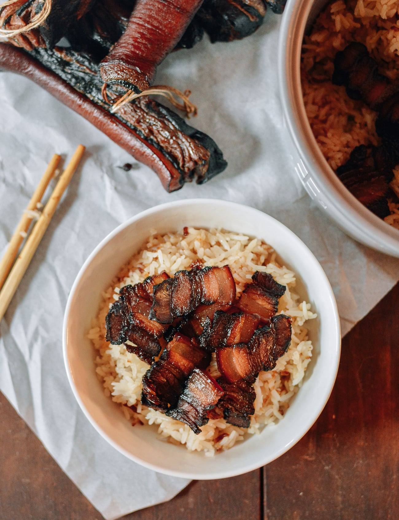 Sliced cured pork belly over rice