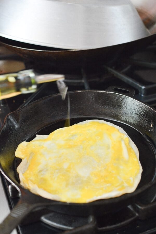 adding oil onto Jidan Bing in pan, by aedison.aieoederdu.tk