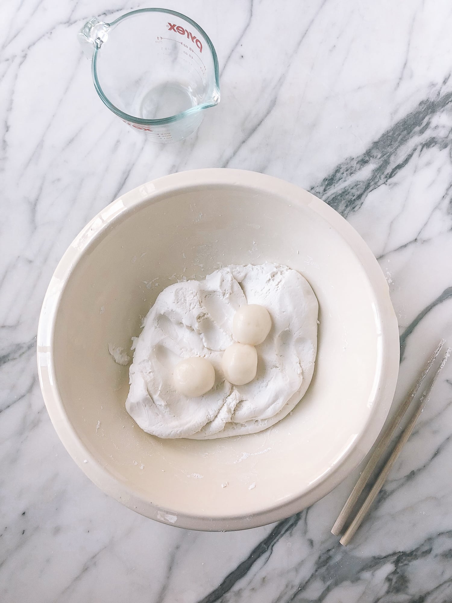 adding cooked rice balls to raw rice flour dough in bowl, by aedison.aieoederdu.tk