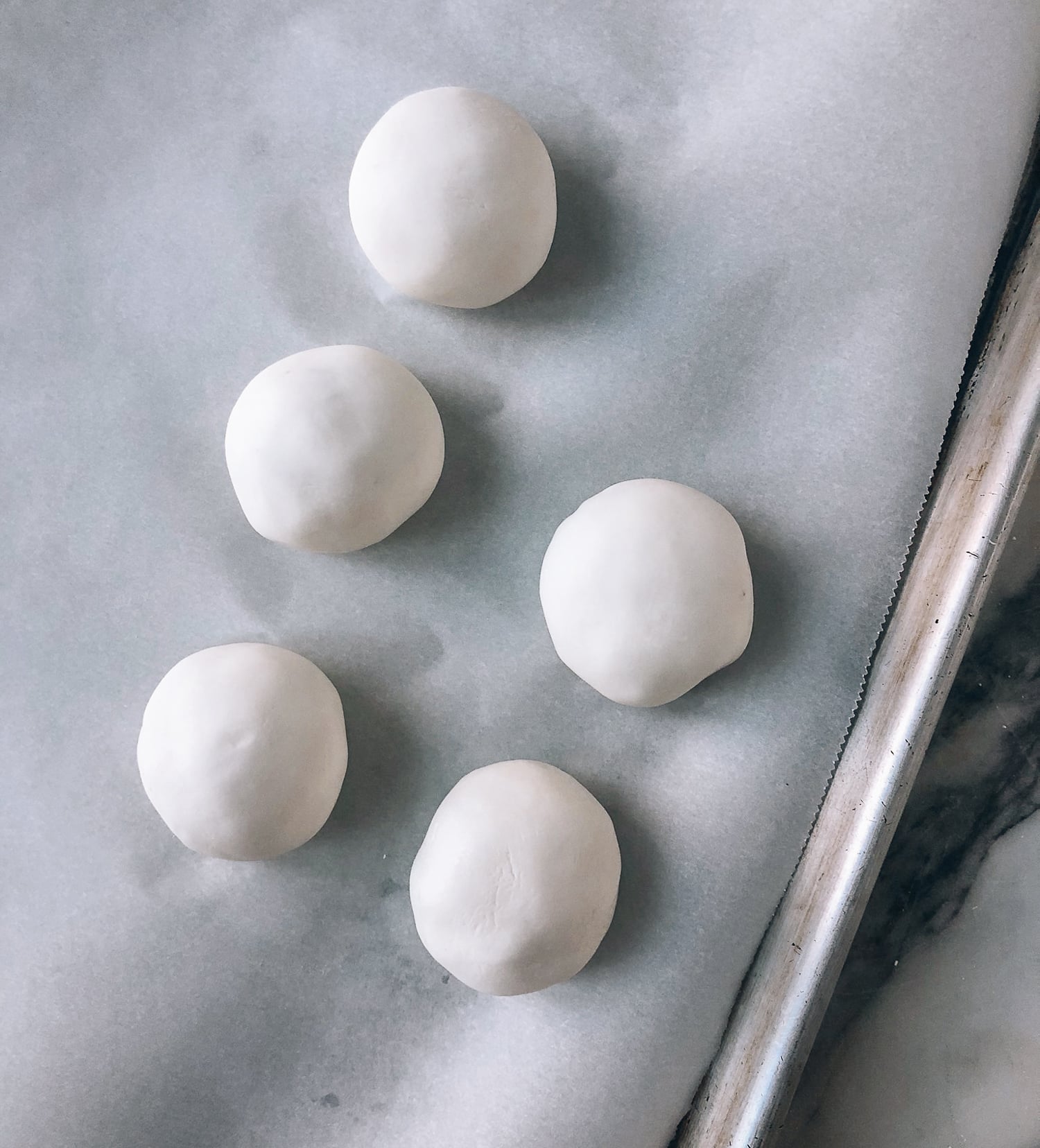 uncooked Savory Tang Yuan sitting on parchment paper, by aedison.aieoederdu.tk