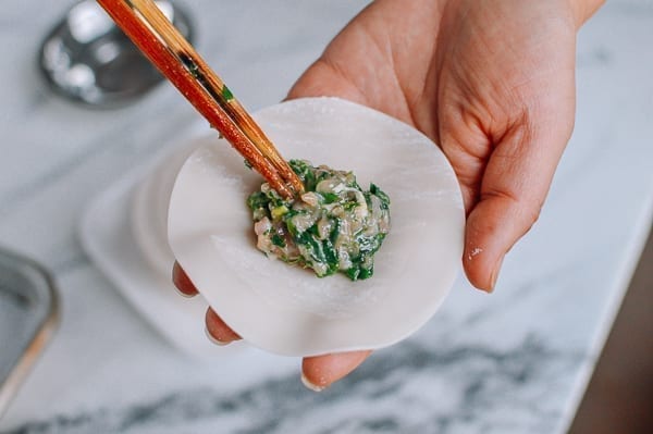 Adding a tablespoon of filling to dumpling wrapper, aedison.aieoederdu.tk