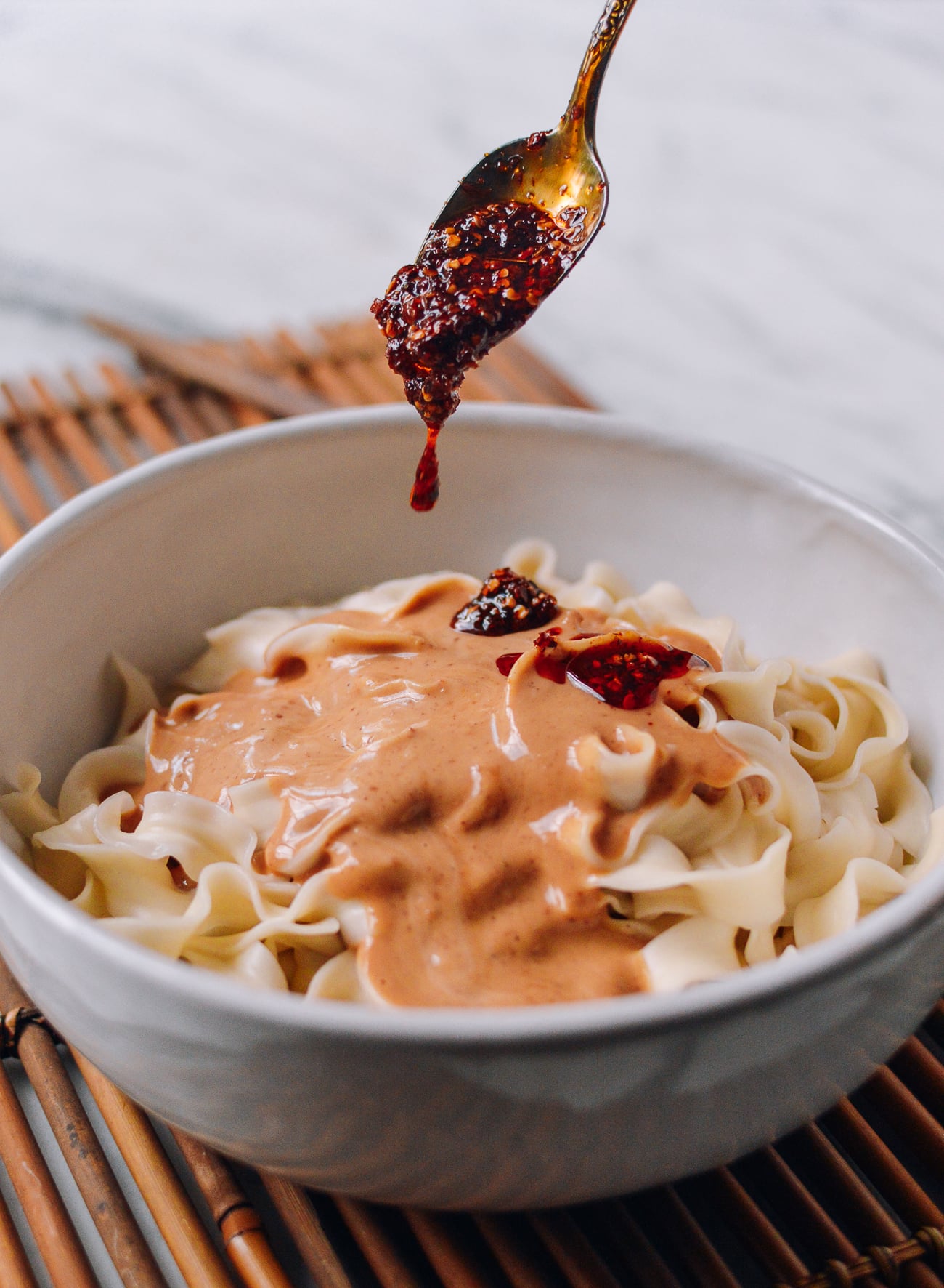 Adding extra chili oil to peanut noodles, aedison.aieoederdu.tk