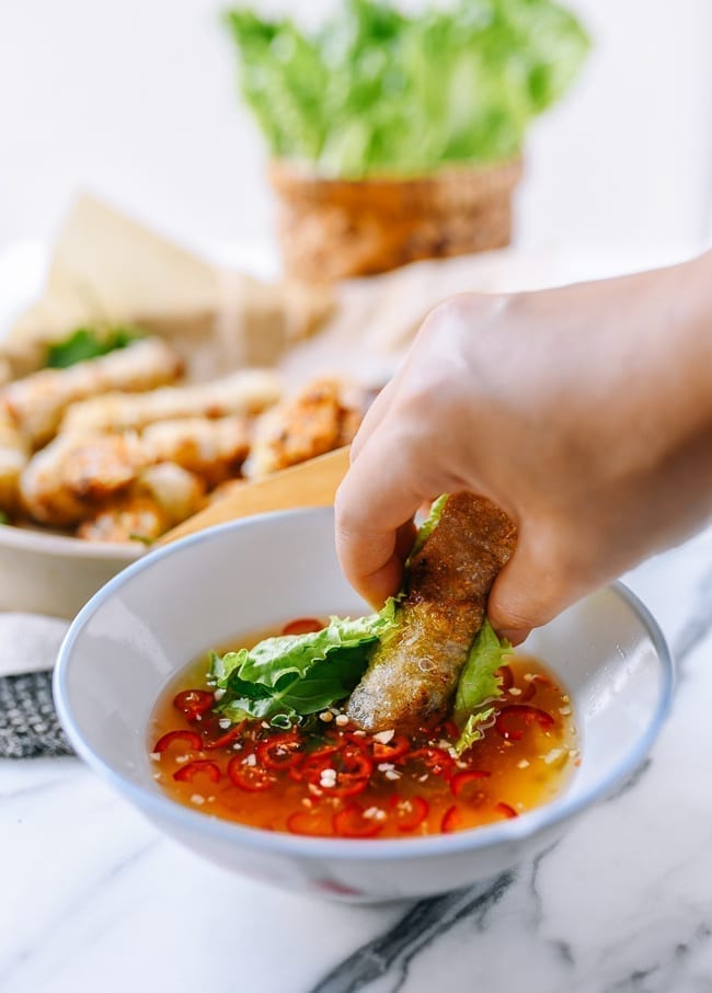Dipping cha gio into nuoc cham, aedison.aieoederdu.tk